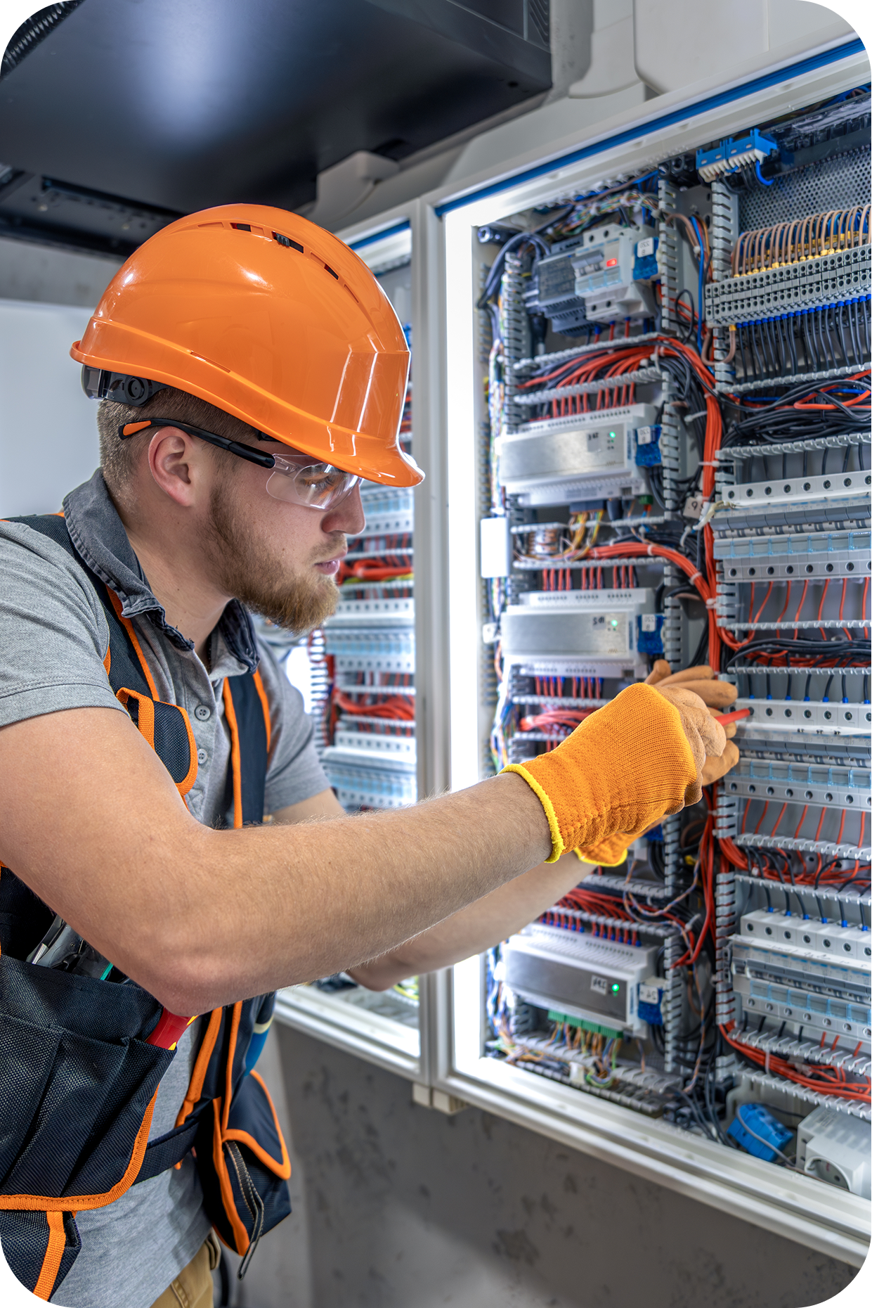 Electrician working on electrical panel
